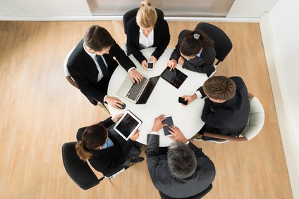 Businesspeople Using Different Electronic Device